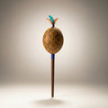 Decorative shaker gourd on stick, arved decoration on the gourd.