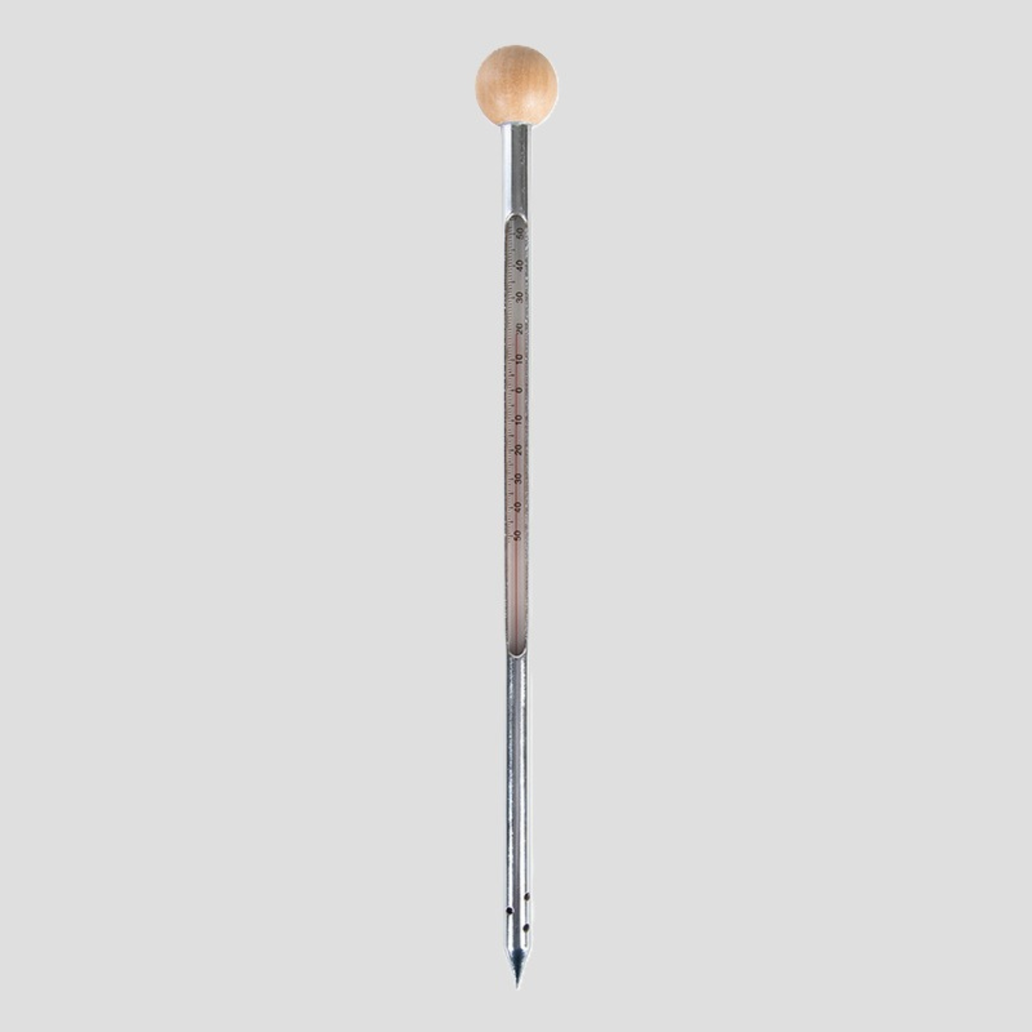 A vertical metal thermometer with a light wood ball at the top and a fine metal tube with printed temperature markings, centered on a solid gray background.