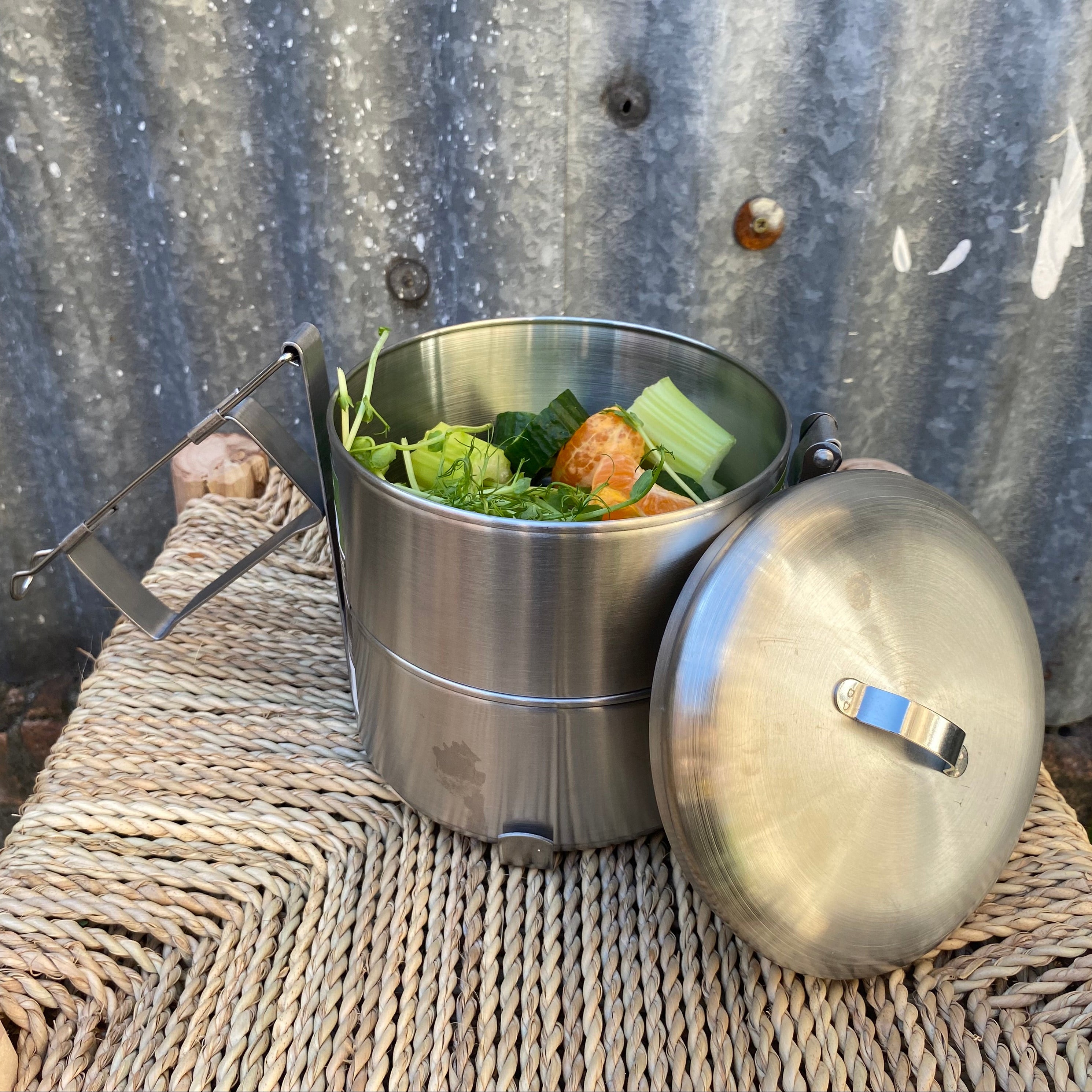two tier bento box shown with food inside