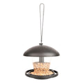 A black bird feeder with a round roof and a perch running around the edge. It has a clear container with seed inside, and a black base.