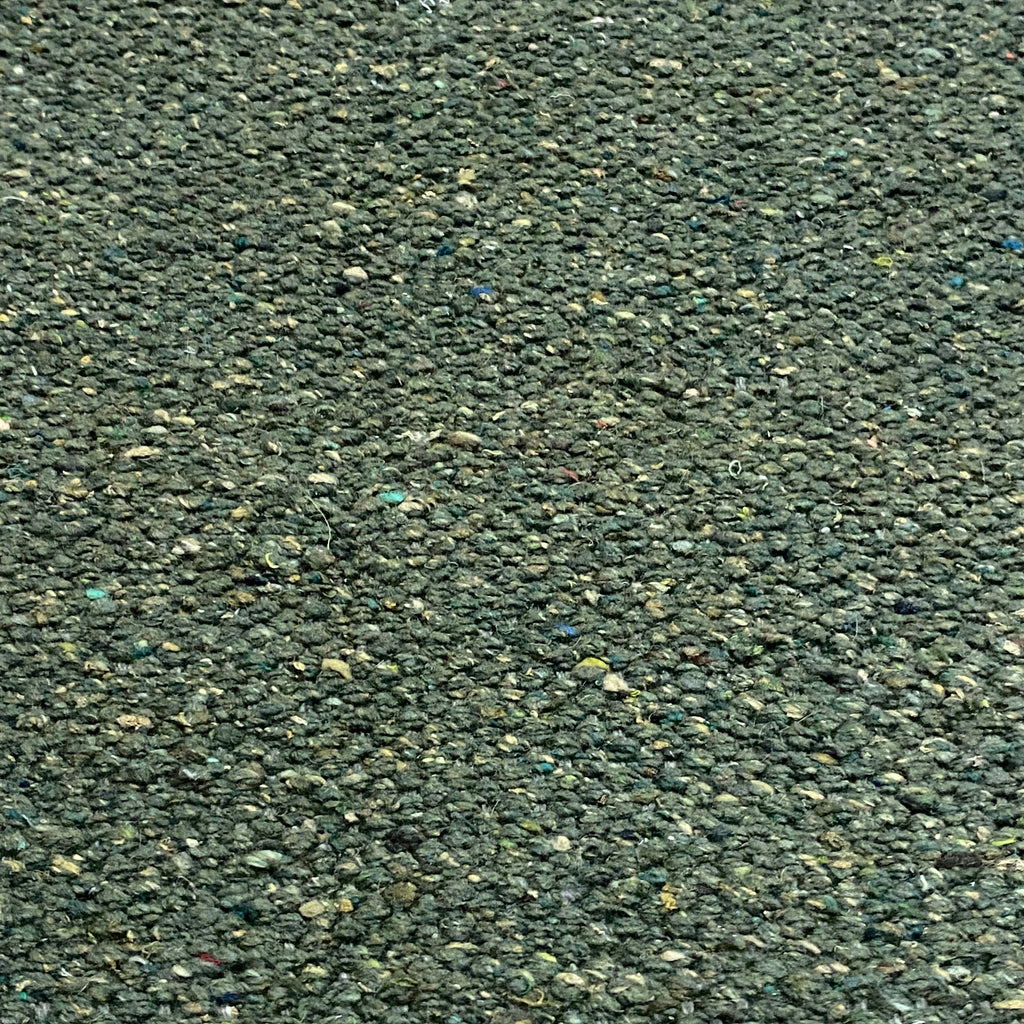 Close-up of green textured rug