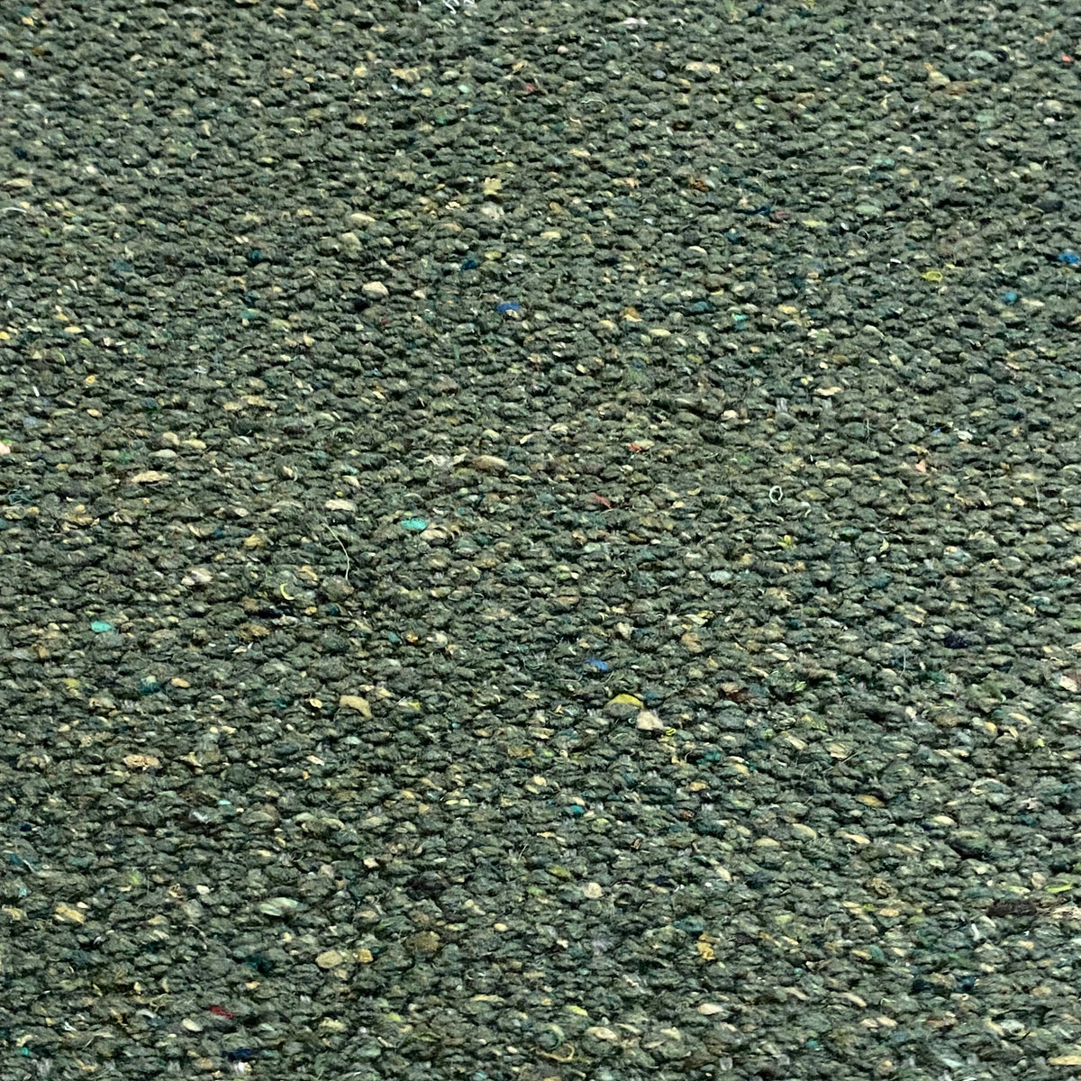 Close-up of green textured rug