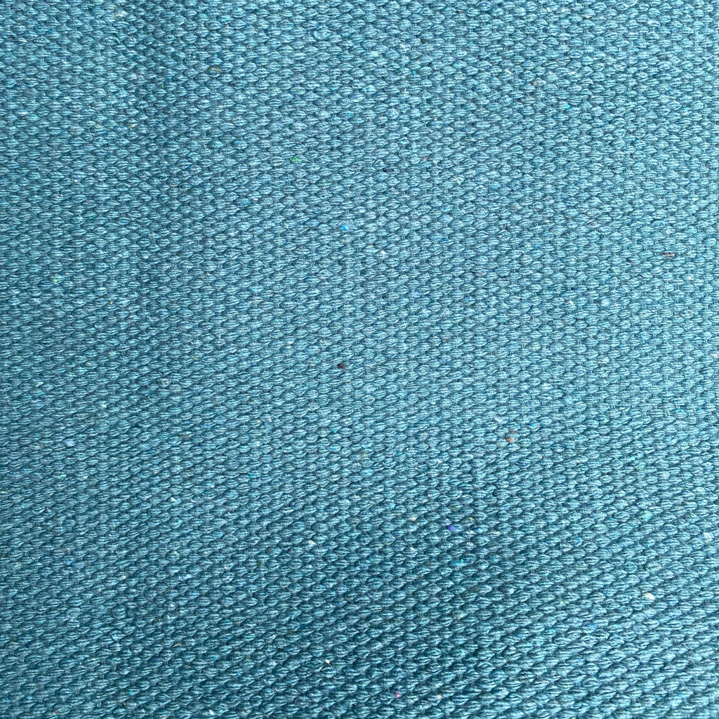 Close-up of teal textured rug