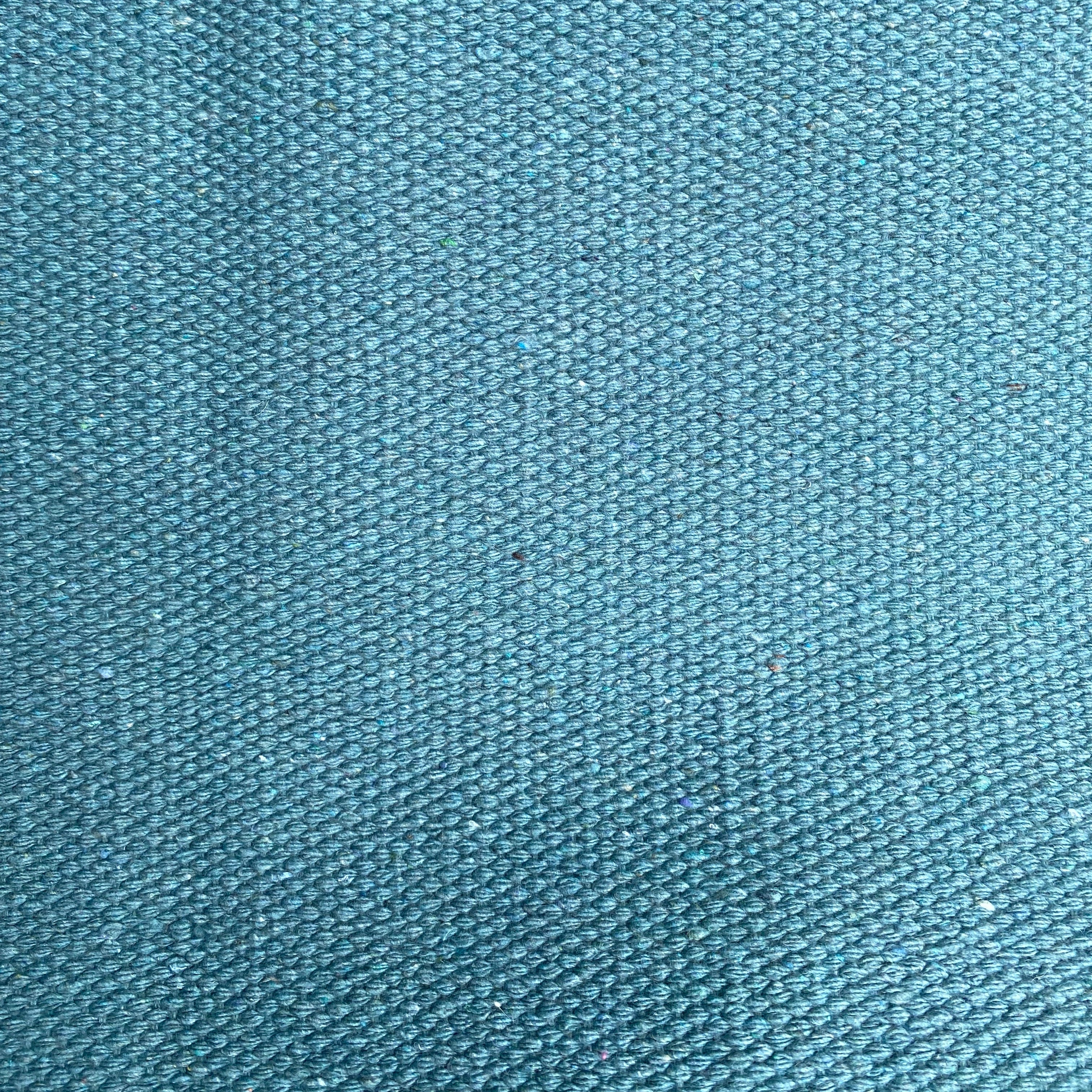 Close-up of teal textured rug