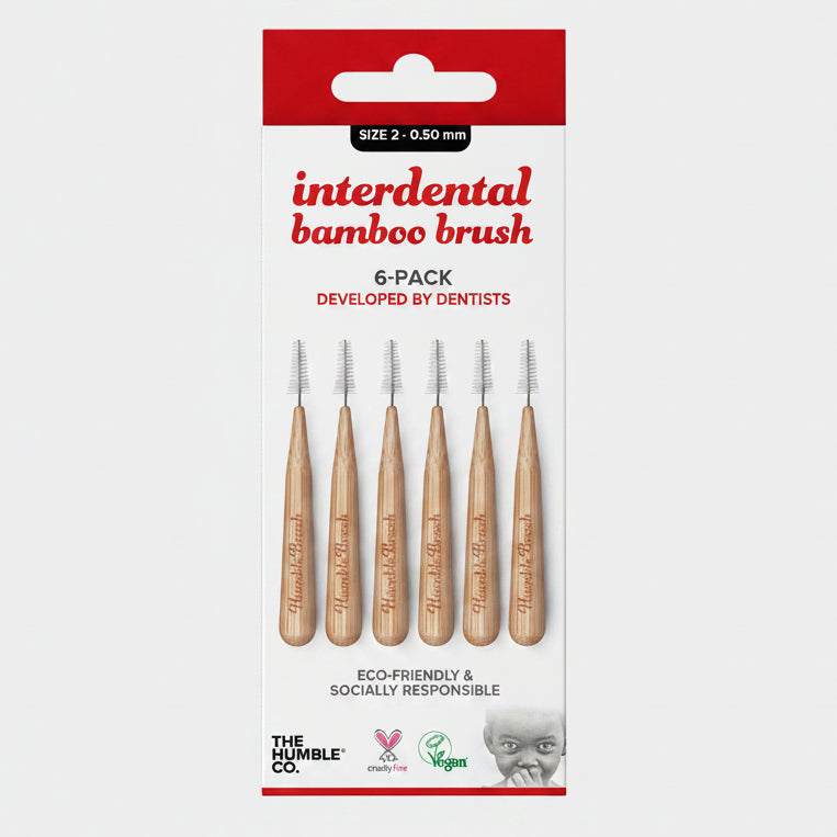 Packaging for Interdental Bamboo Brush by The Humble Co., featuring six brushes with bamboo handles and nylon bristles, designed for dental use.