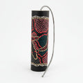 Thunder drum painted with colourful dots a spring attached to one end