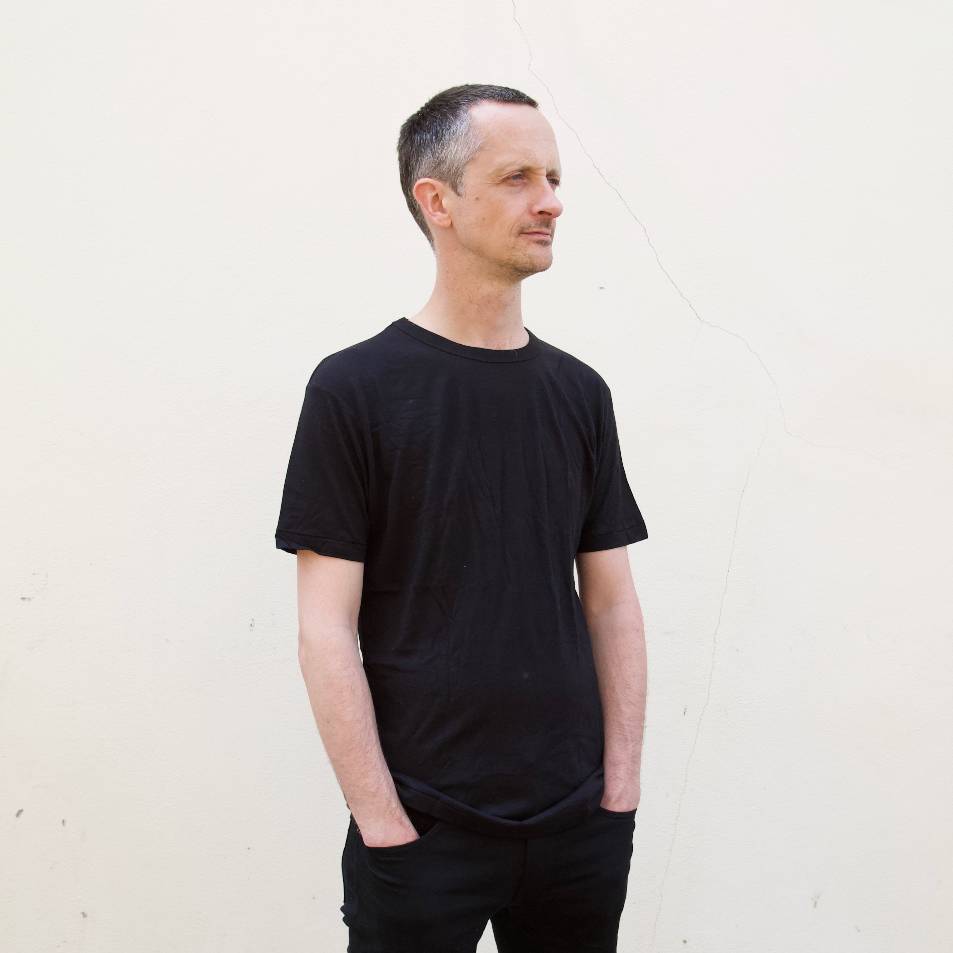 a man wearing a black t shirt