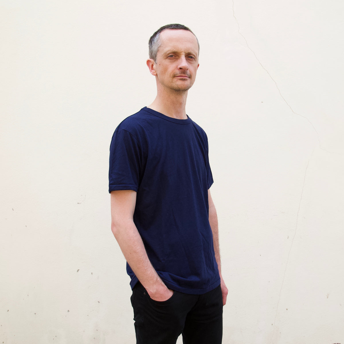 a person wearing a navy t shirt
