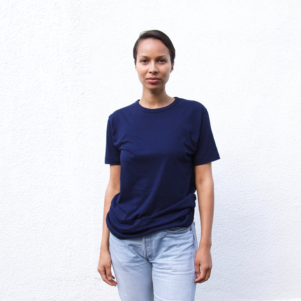 a women waering a navy t shirt