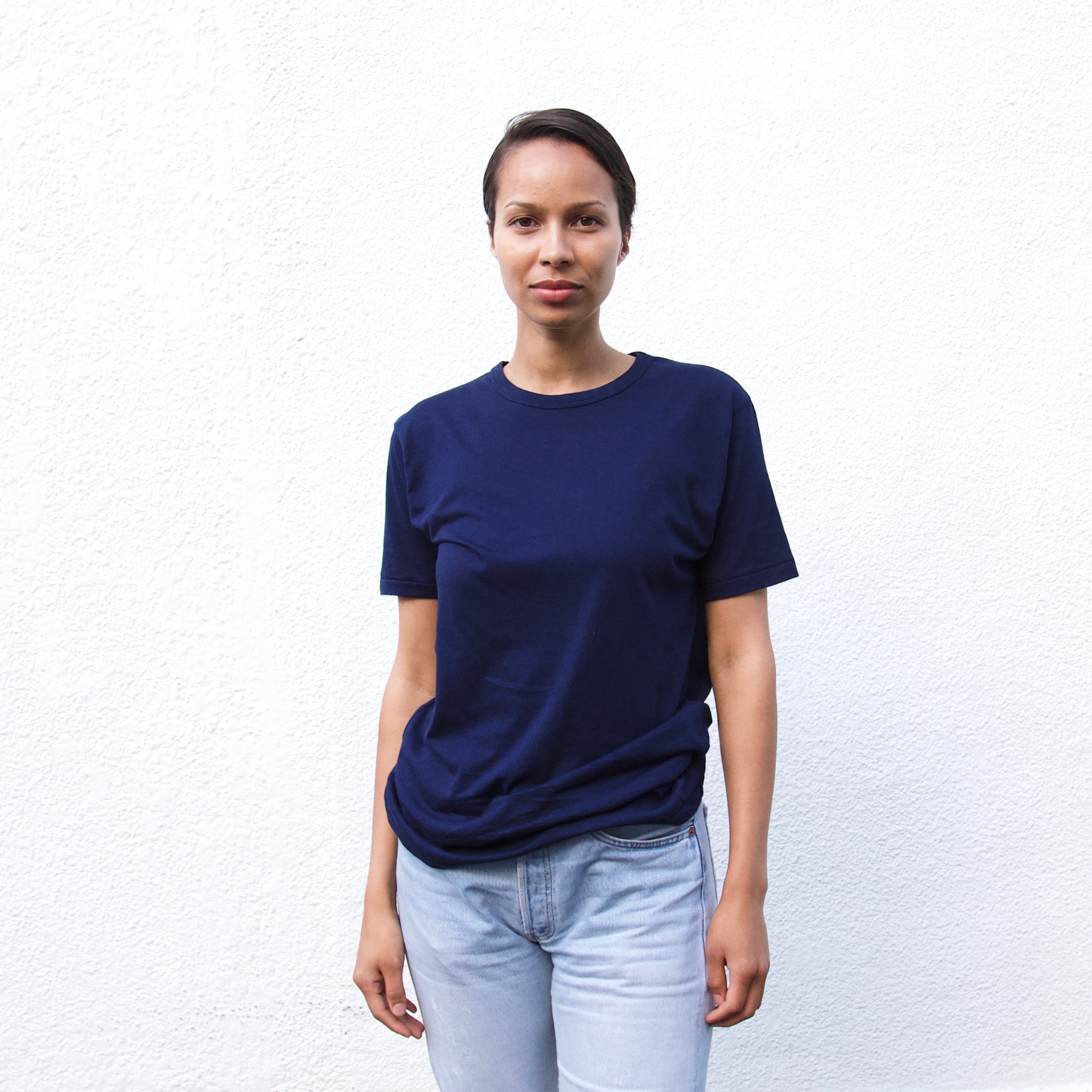 a women waering a navy t shirt