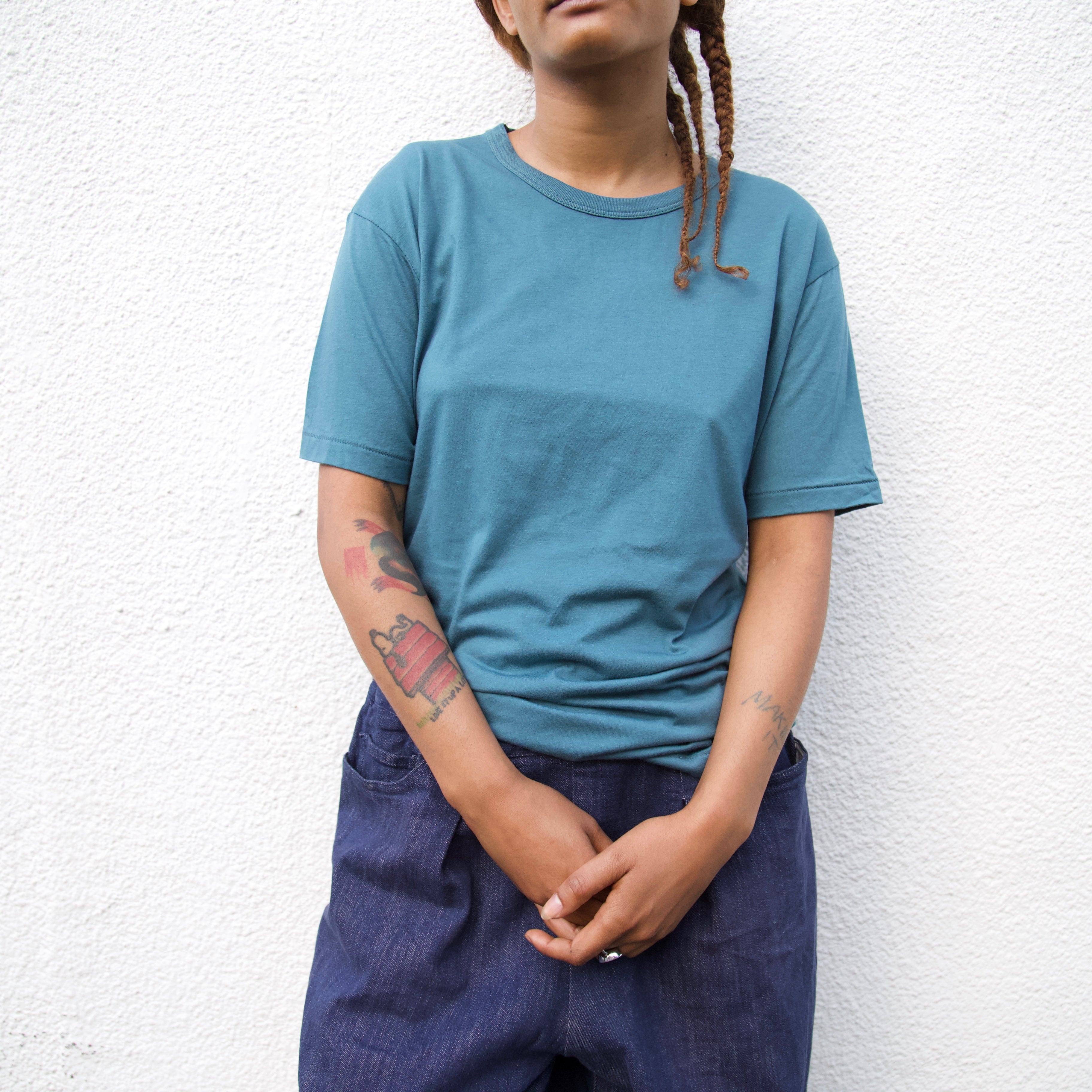 a women wearing an olive t shirt