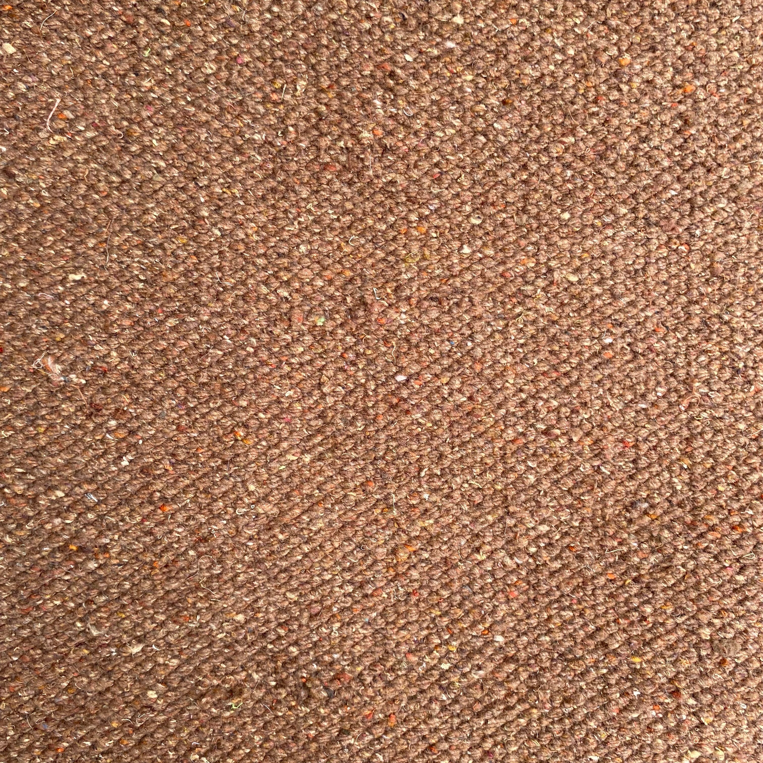 Close-up of camel textured rug