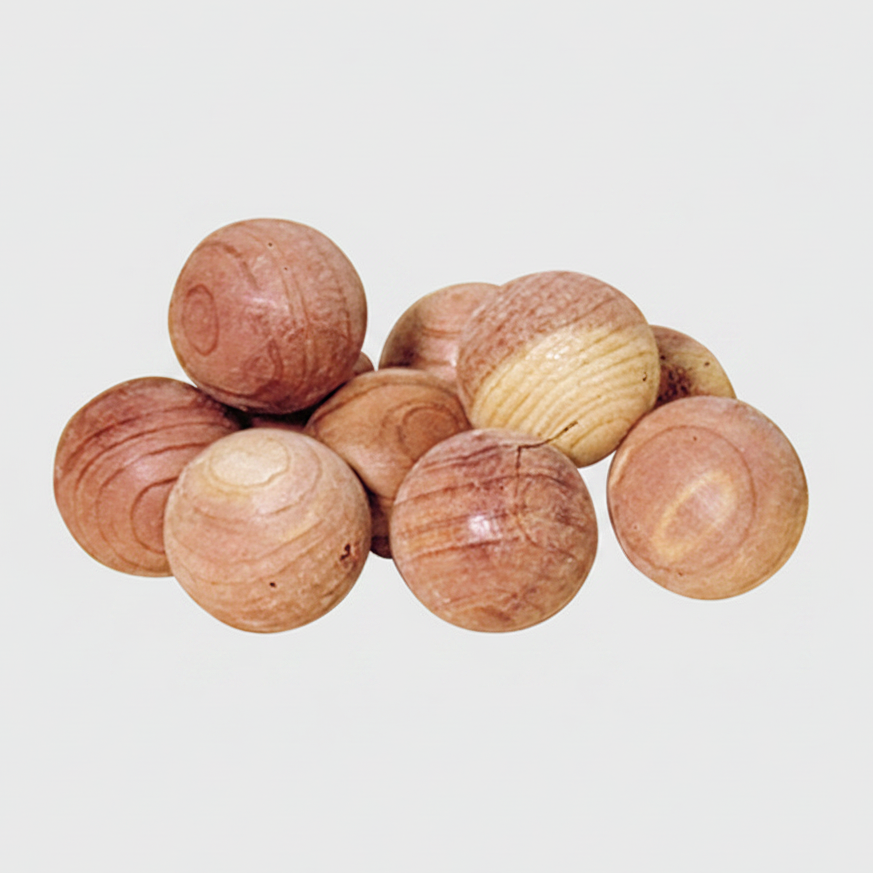 A collection of brown red cedar balls with a rough texture, used for natural moth protection.