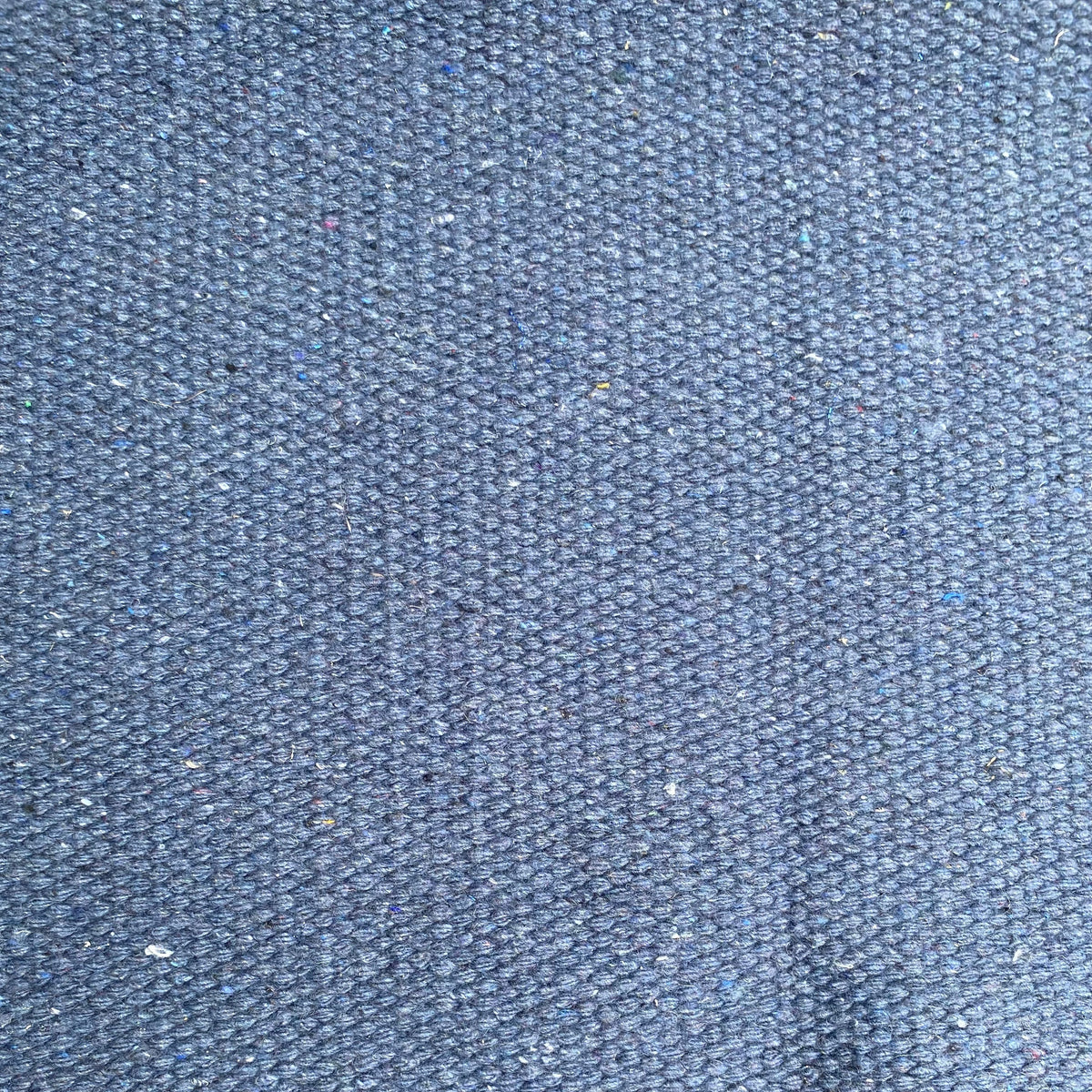 Close-up of denim textured rug