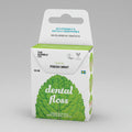Packaging of 'The Humble Co. Dental Floss' with 'Fresh Mint' flavor, featuring 50 meters of floss, candelilla wax, and labeled as vegan and cruelty-free with xylitol.