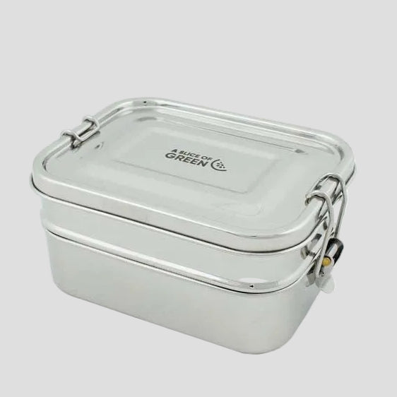 A stainless steel two-tier leak-resistant lunch box with a lid and locks.