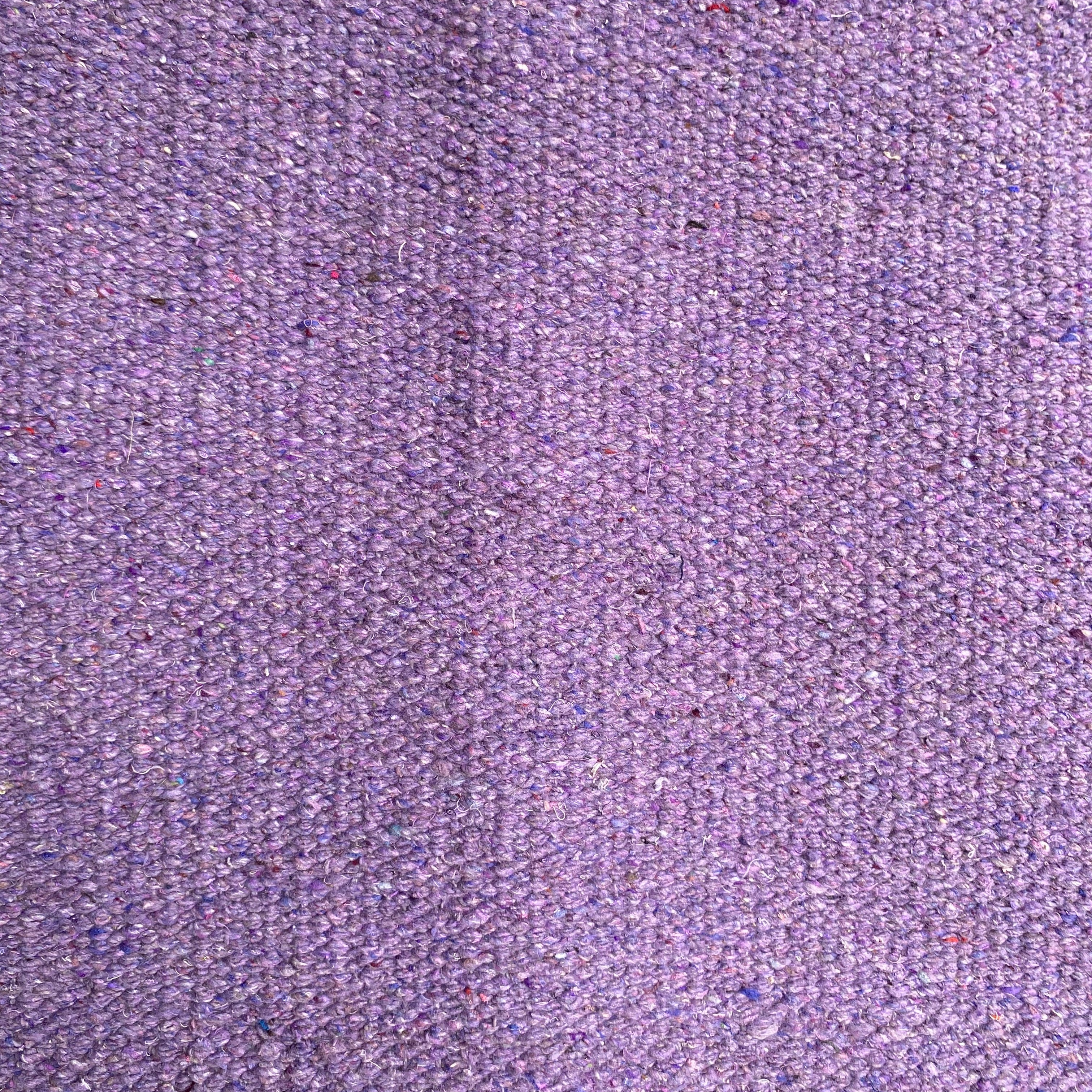 Close-up of lilac textured rug