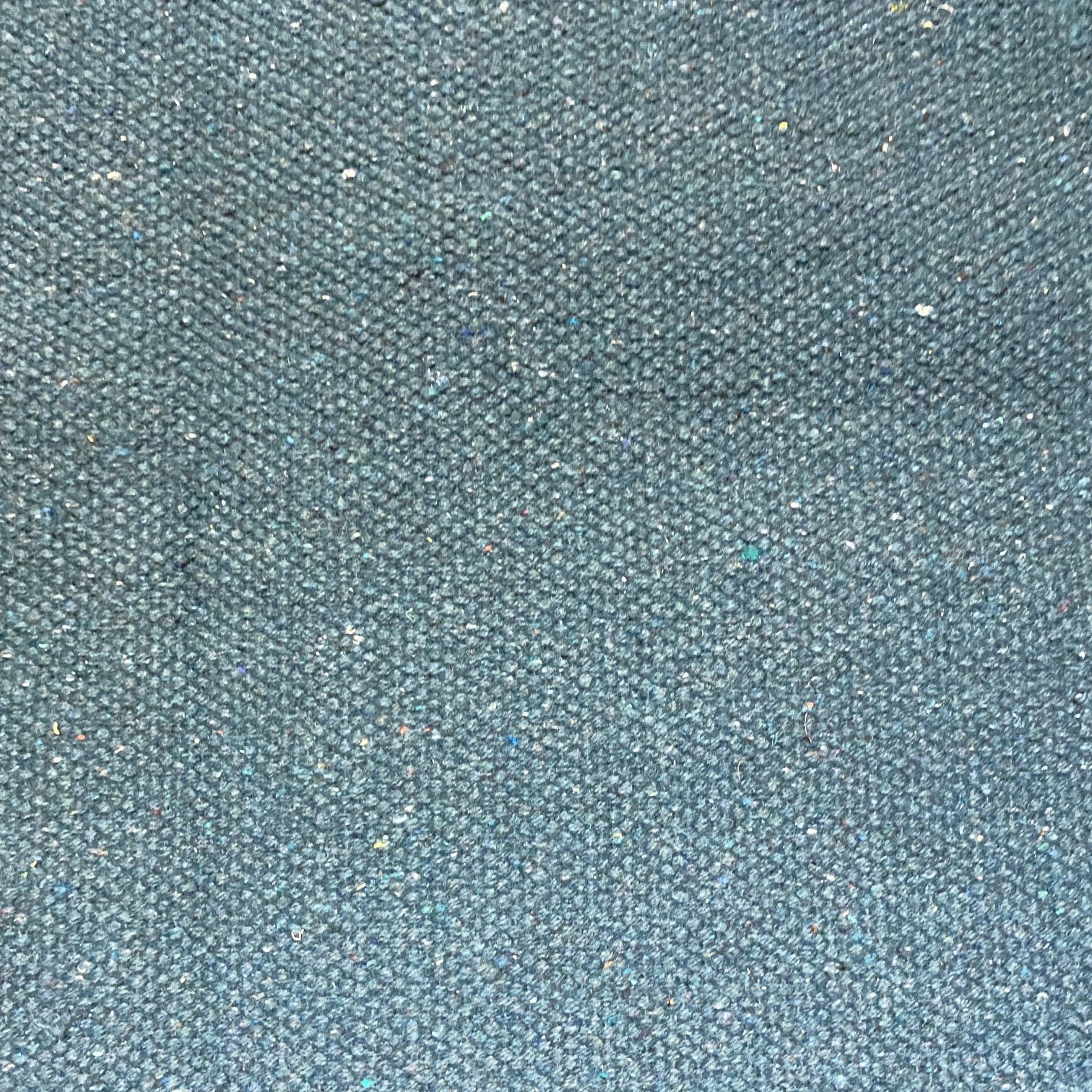Close-up of mallard blue textured rug