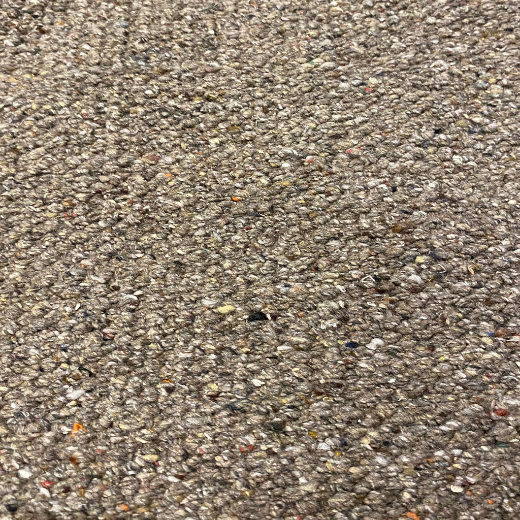 Close-up of mid brown textured rug