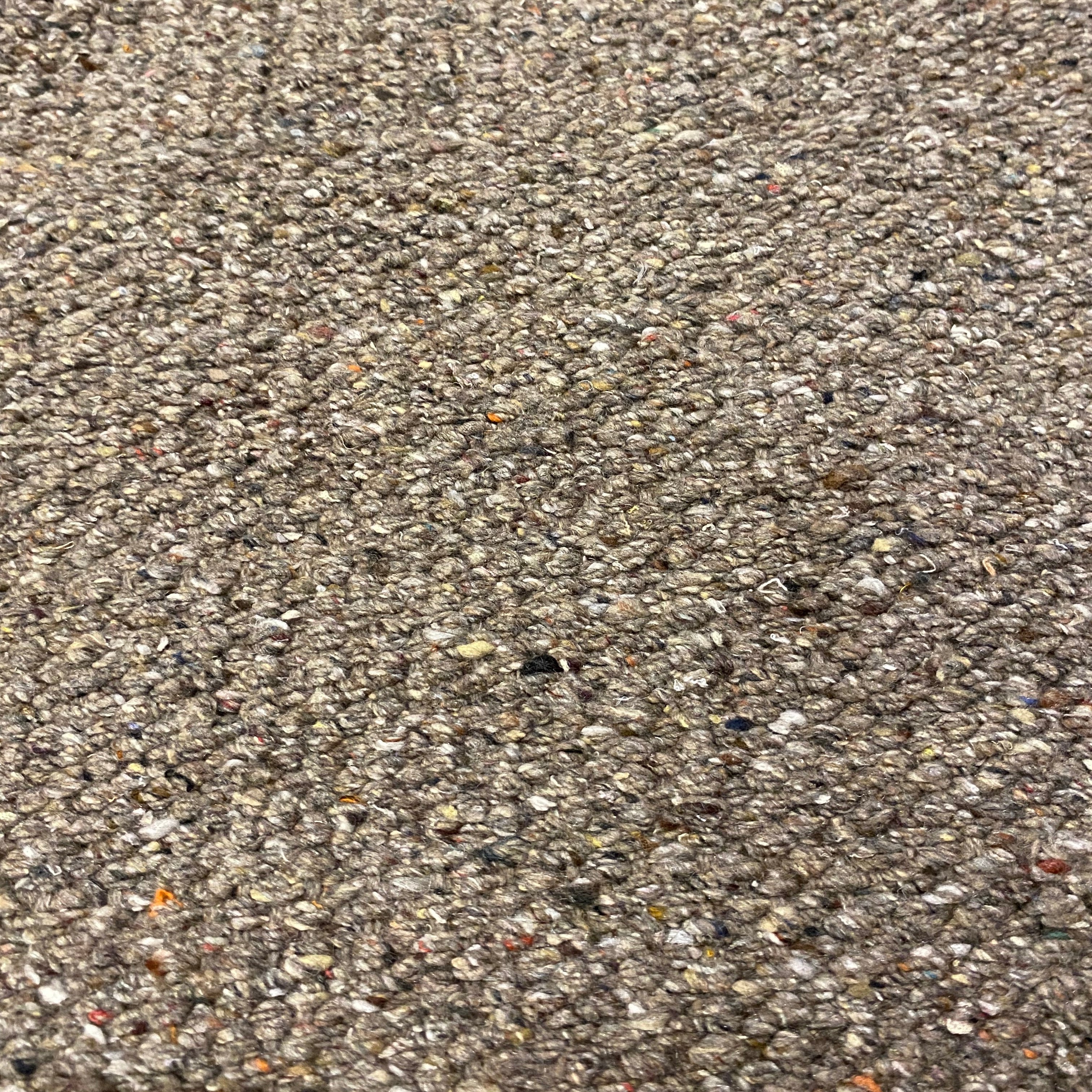 Close-up of mid brown textured rug