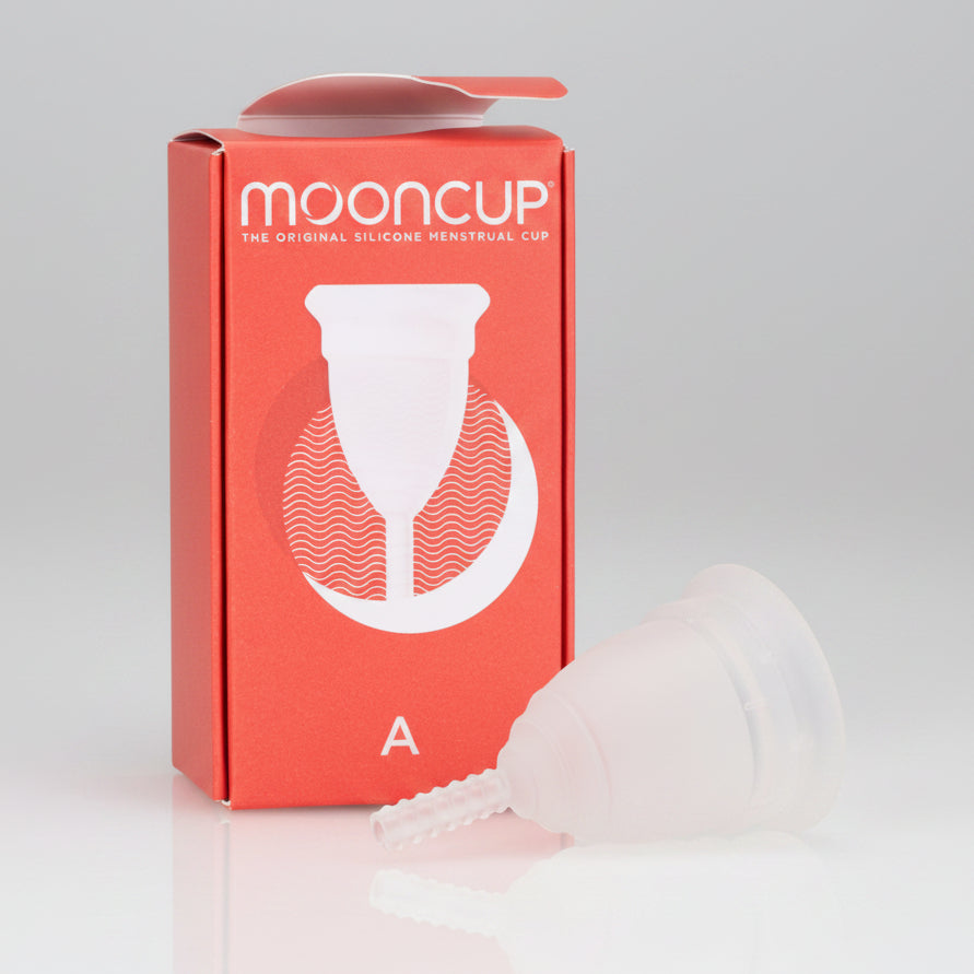 A Mooncup menstrual cup in white color, displayed next to its orange packaging with the brand name and size 'A' indicated.