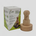A wooden classic paper pot maker stamp alongside its white and green product packaging box, set against a plain light gray background.