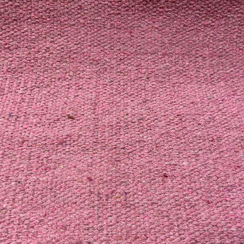 Close-up of pink textured rug