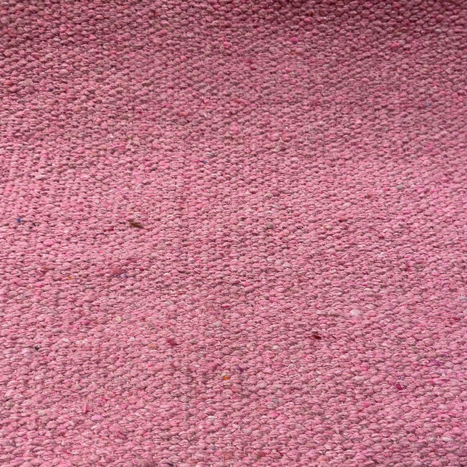 Close-up of pink textured rug