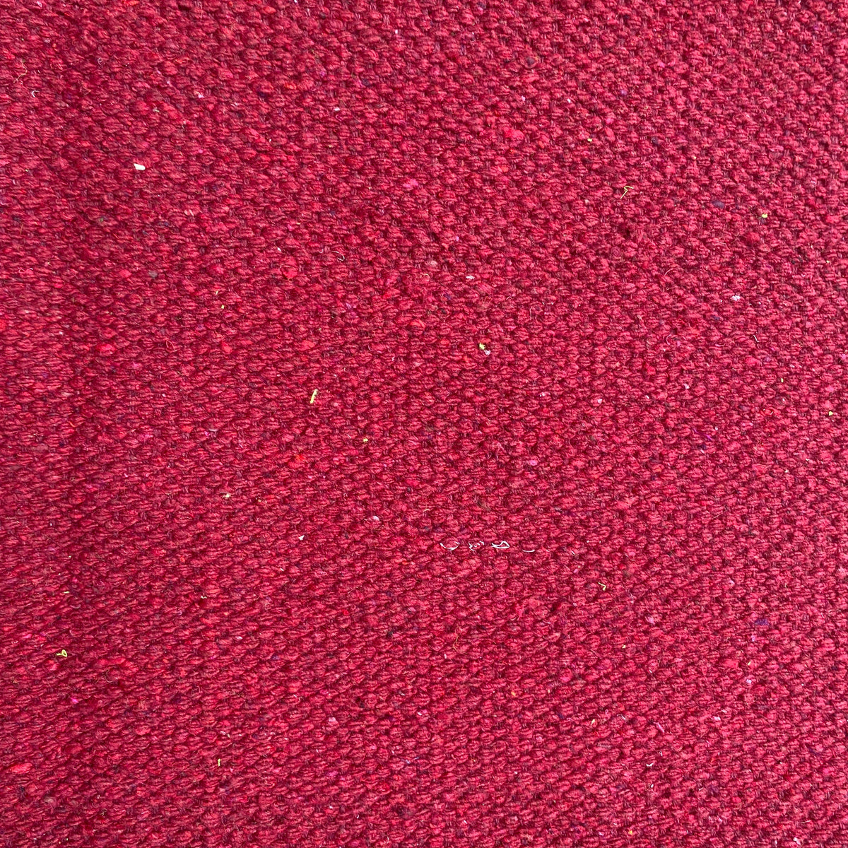 Close-up of plum textured rug