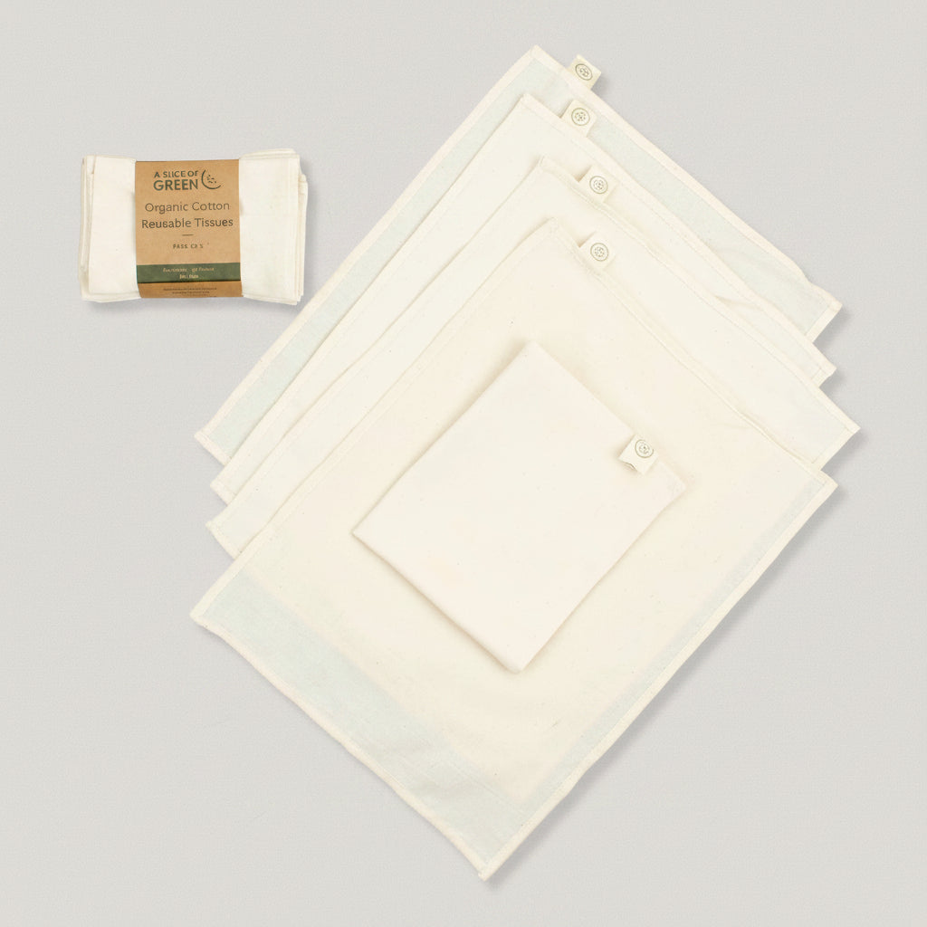A pack of white reusable organic cotton tissues displayed with one tissue partially pulled out from the pack, showing the texture and size. The branded label 'Green Pioneer' is visible on the tissue pack.