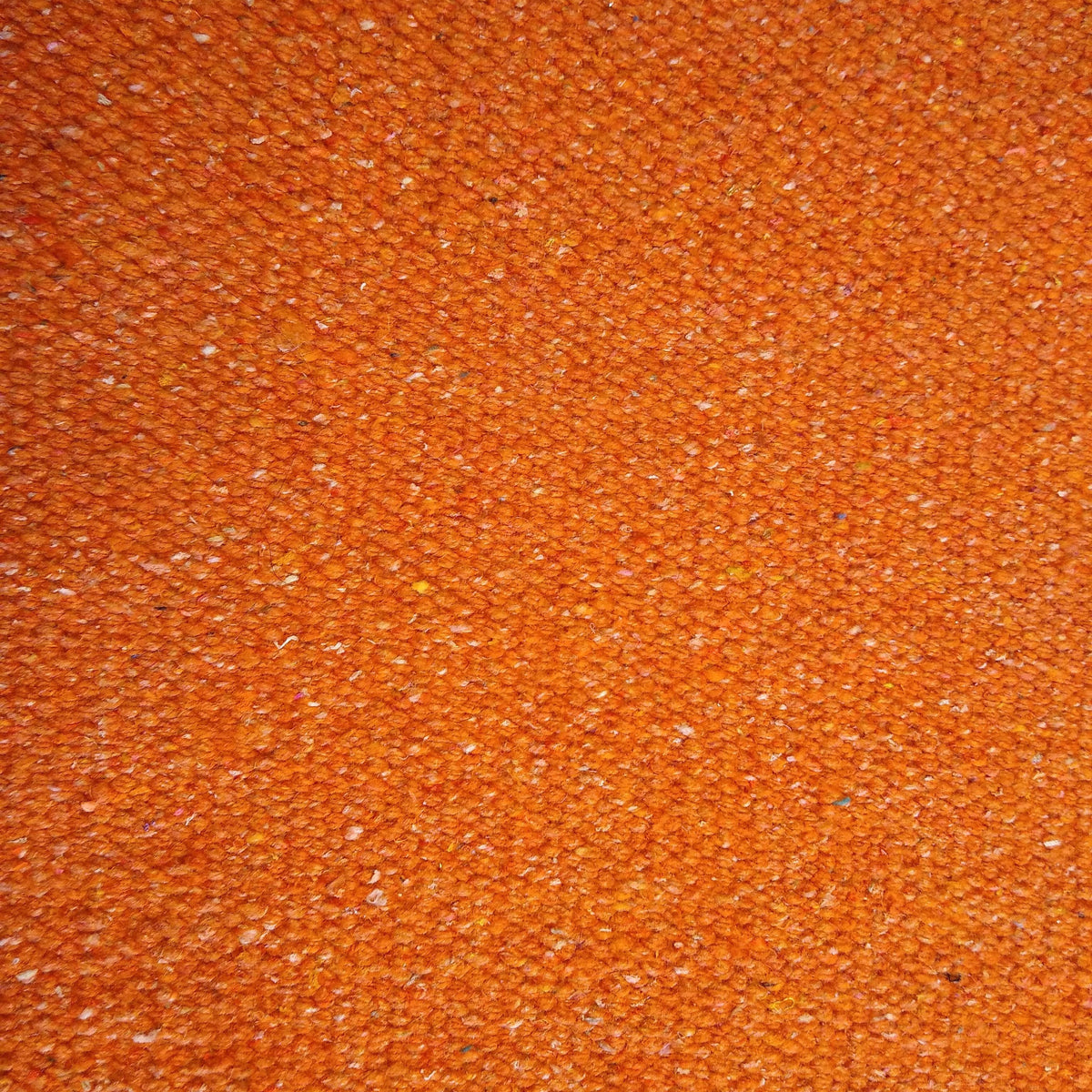 Close-up of rust textured rug