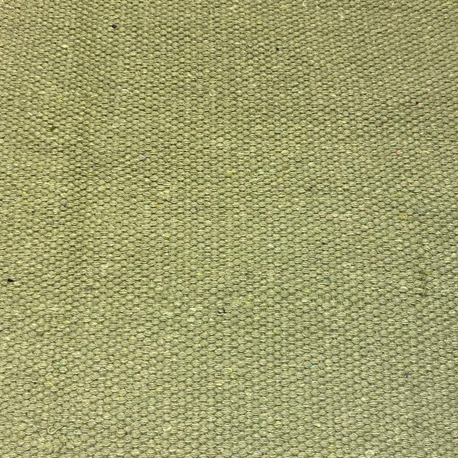 Close-up of sea green textured rug