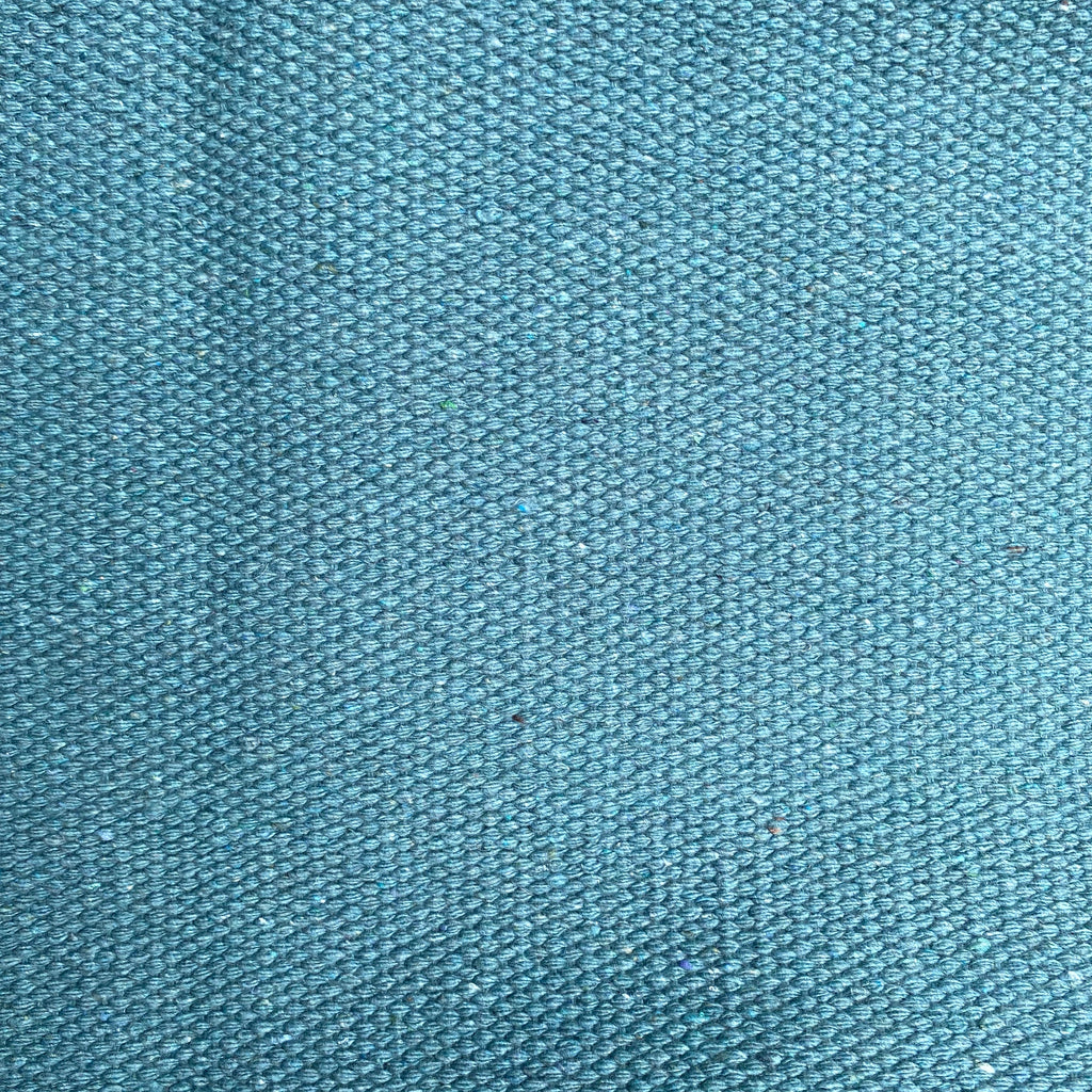 Close-up of teal textured rug