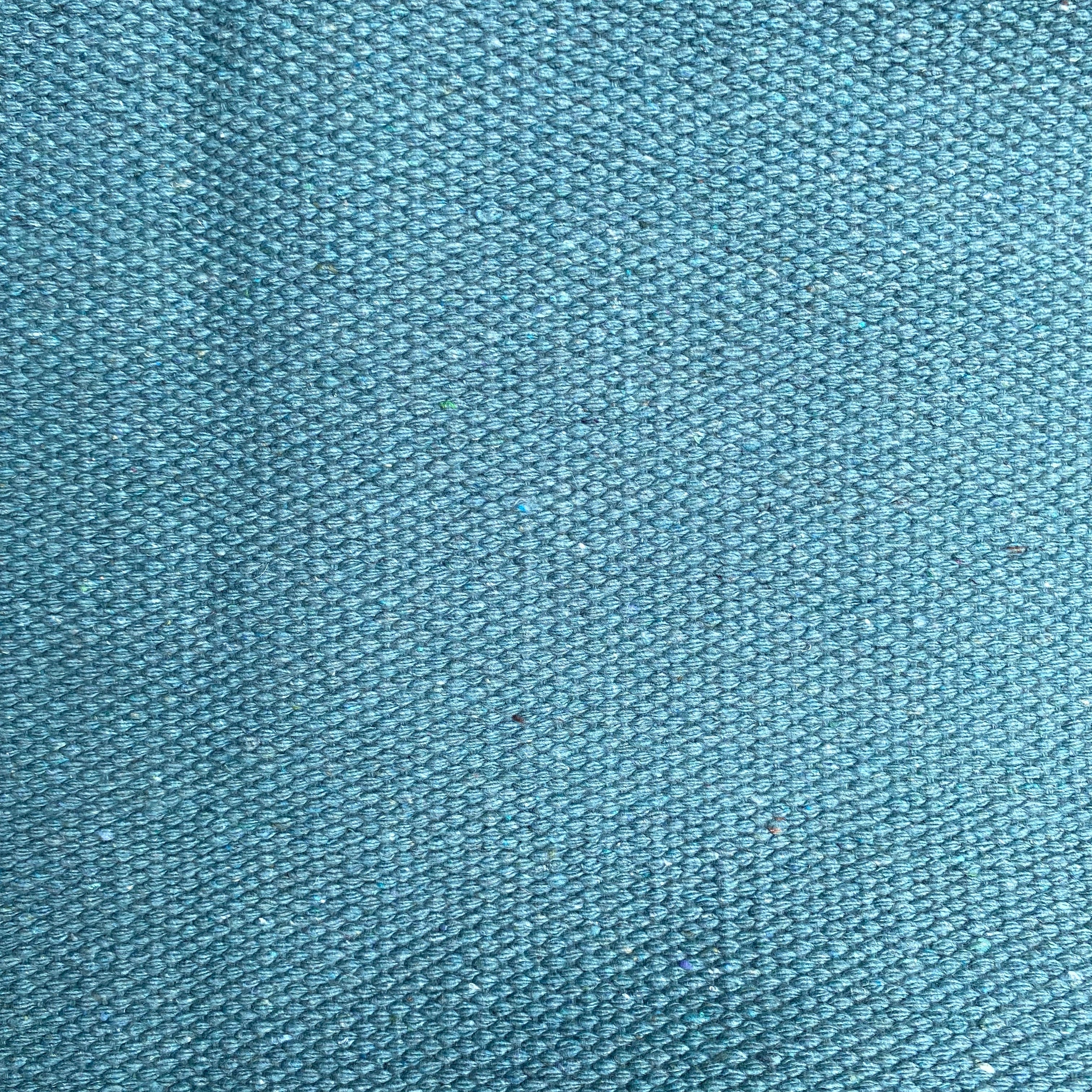 Close-up of teal textured rug